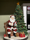 Santa beside Christmas Tree